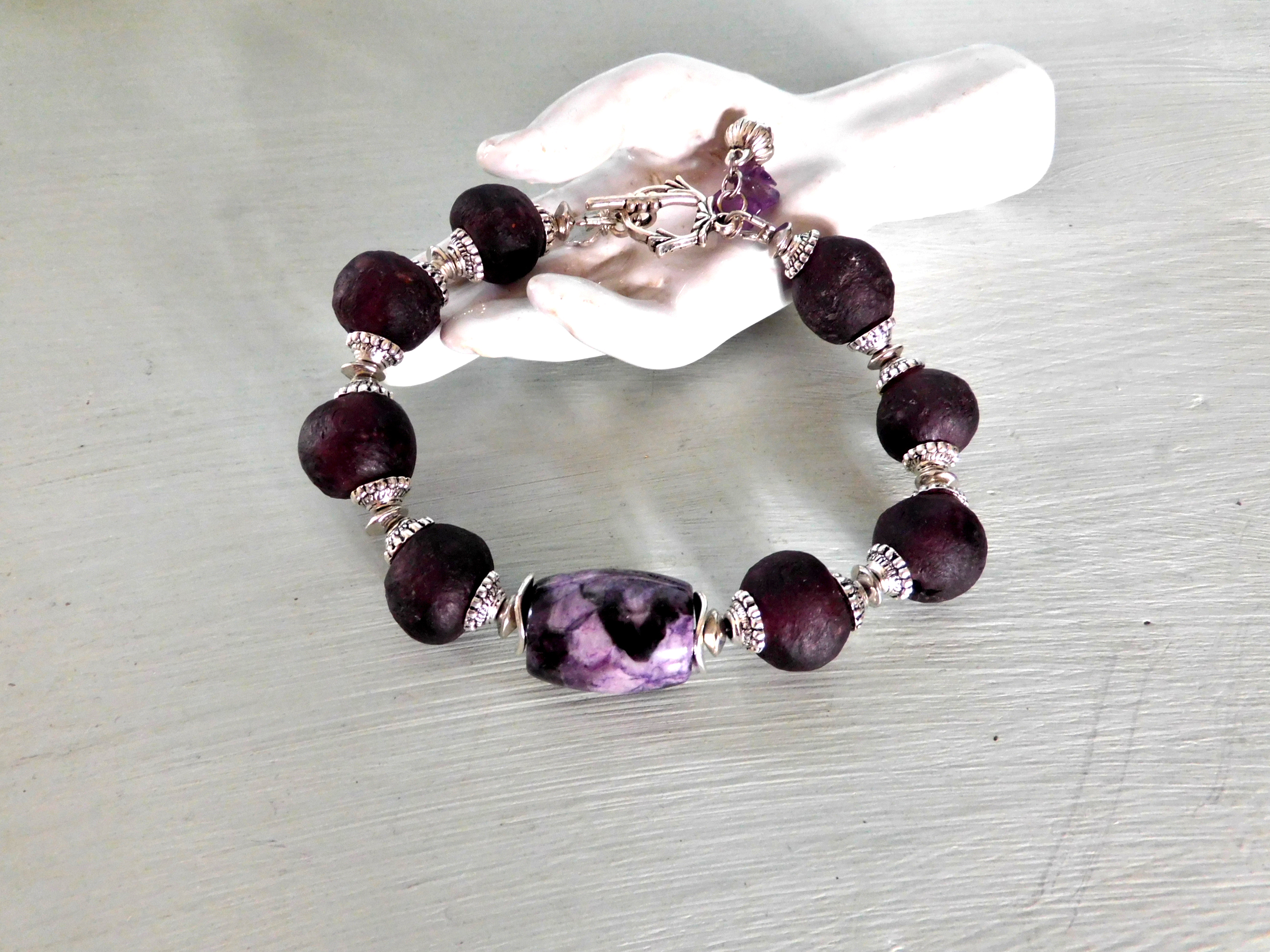 bracelet with aubergine colored Krobo Recyclingglass beads and purple jasper