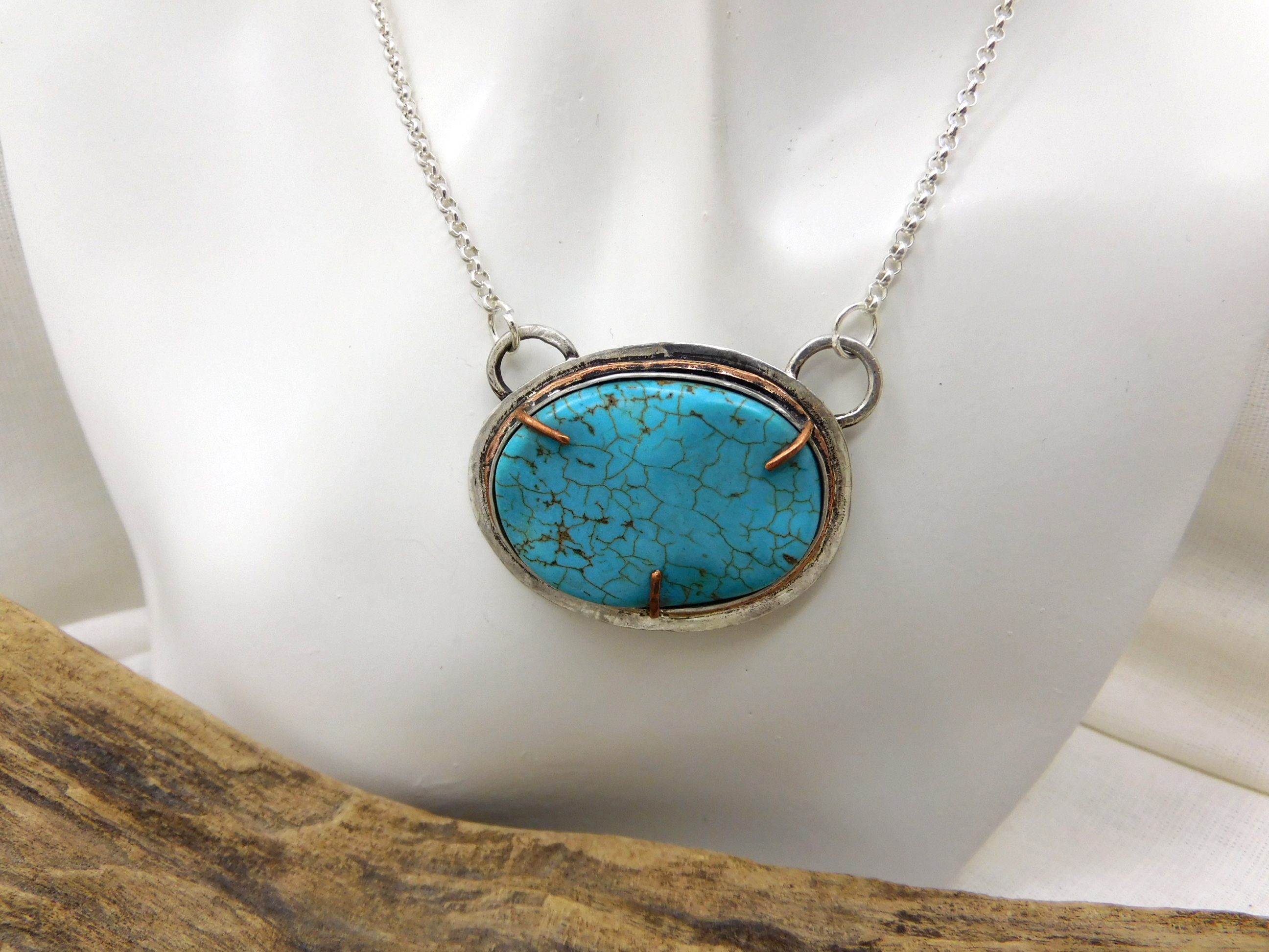 Pendant with turquoise Howlite stone set in sterling silver and copper