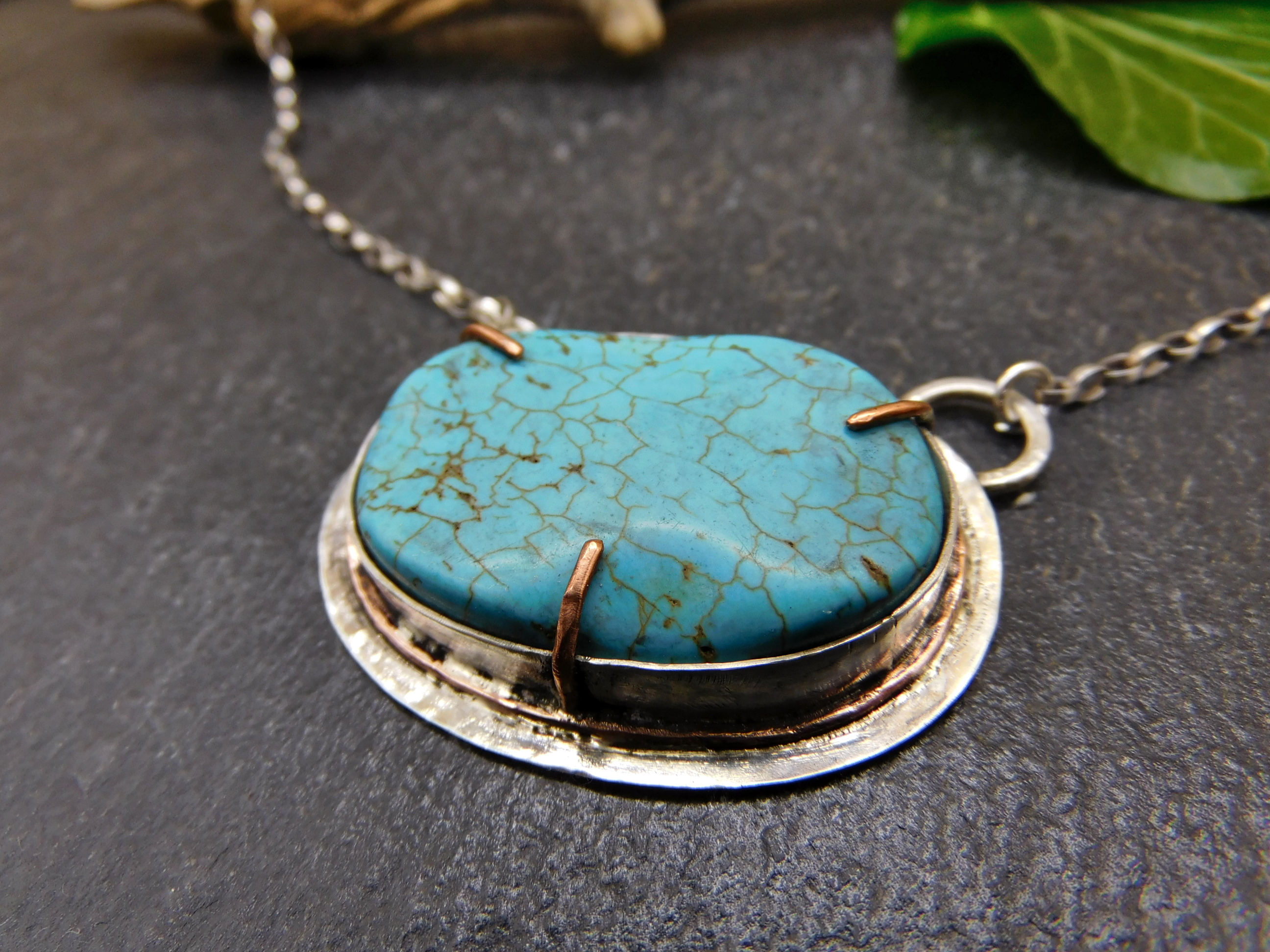 Pendant with turquoise Howlite stone set in sterling silver and copper