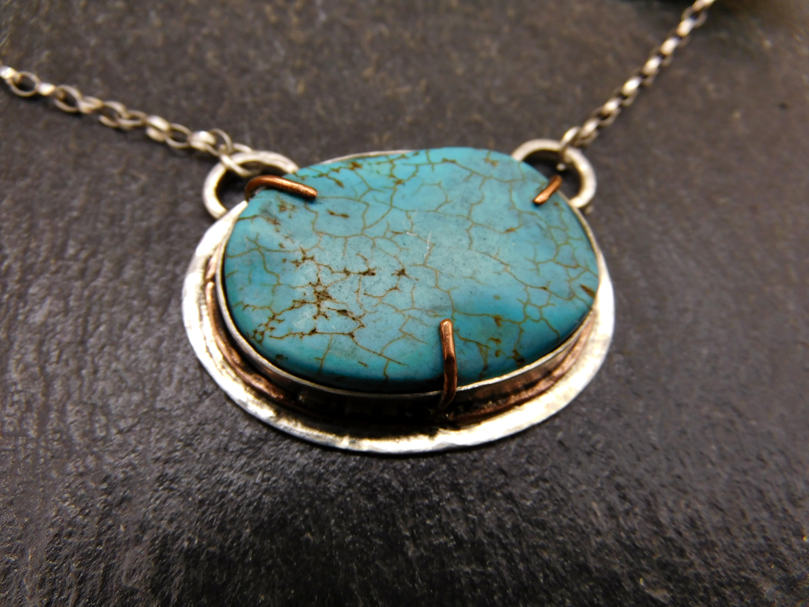 Pendant with turquoise Howlite stone set in sterling silver and copper