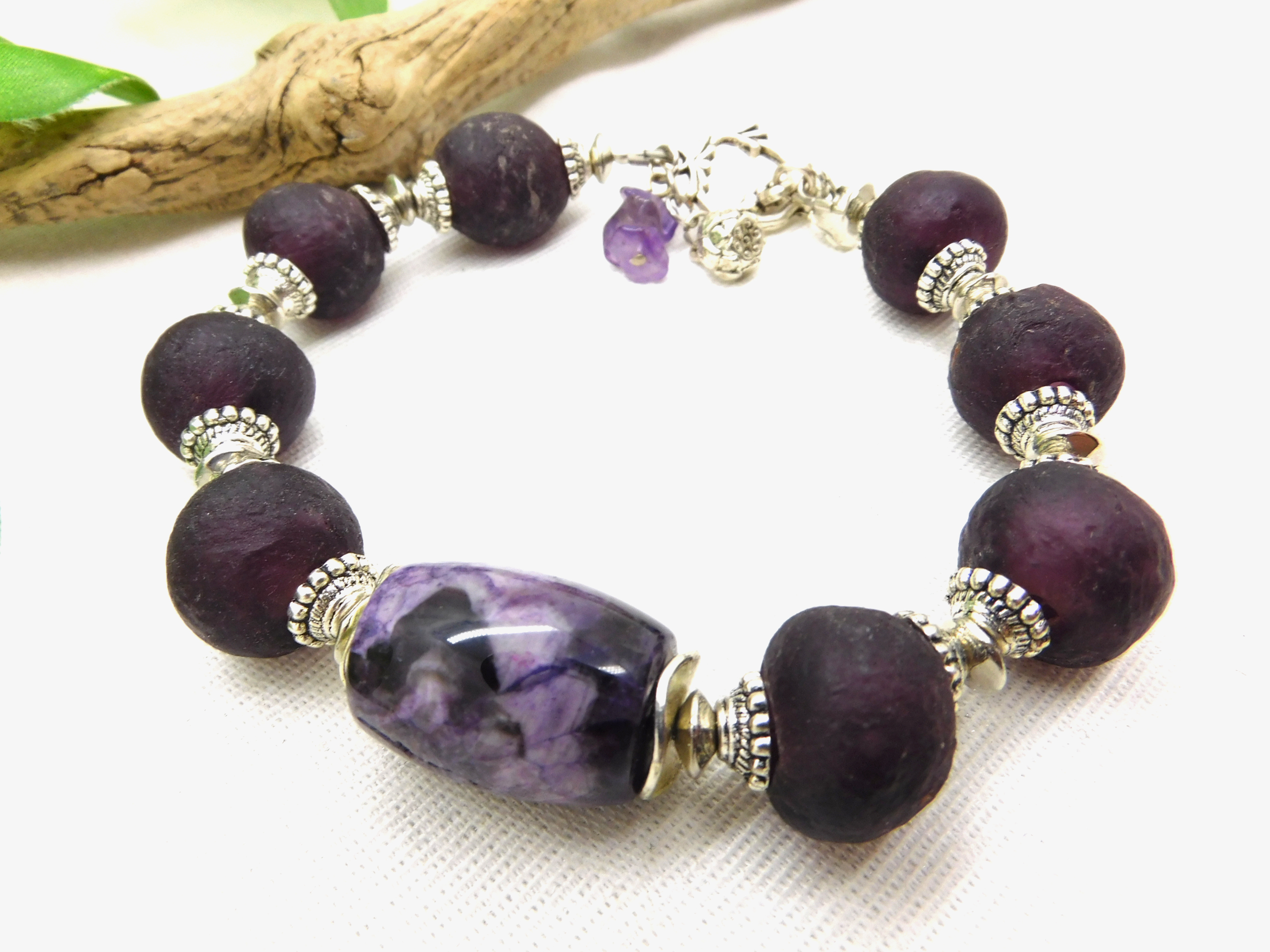 bracelet with aubergine colored Krobo Recyclingglass beads and purple jasper