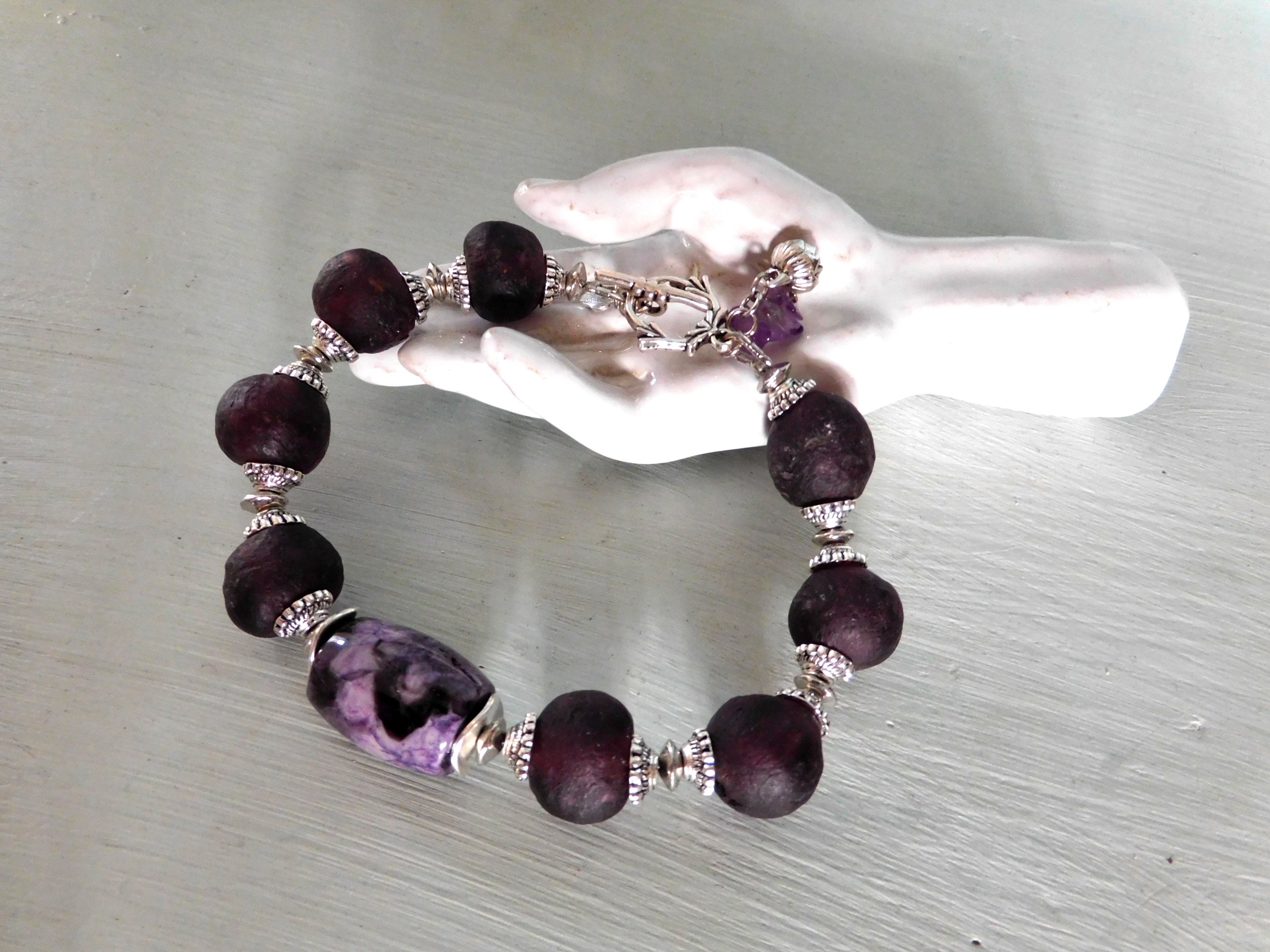 bracelet with aubergine colored Krobo Recyclingglass beads and purple jasper