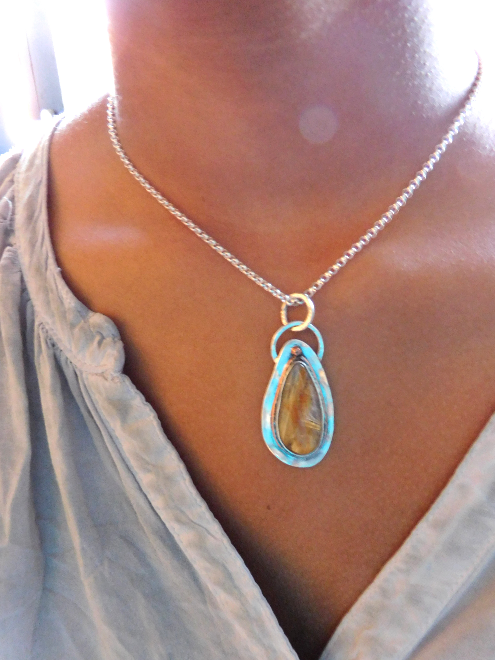 Pendant with rutilated Quartz stone set in sterling silver and copper